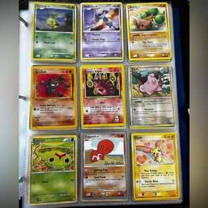 18 Pokémon cards including 3 reverse holo cards and two world championship
